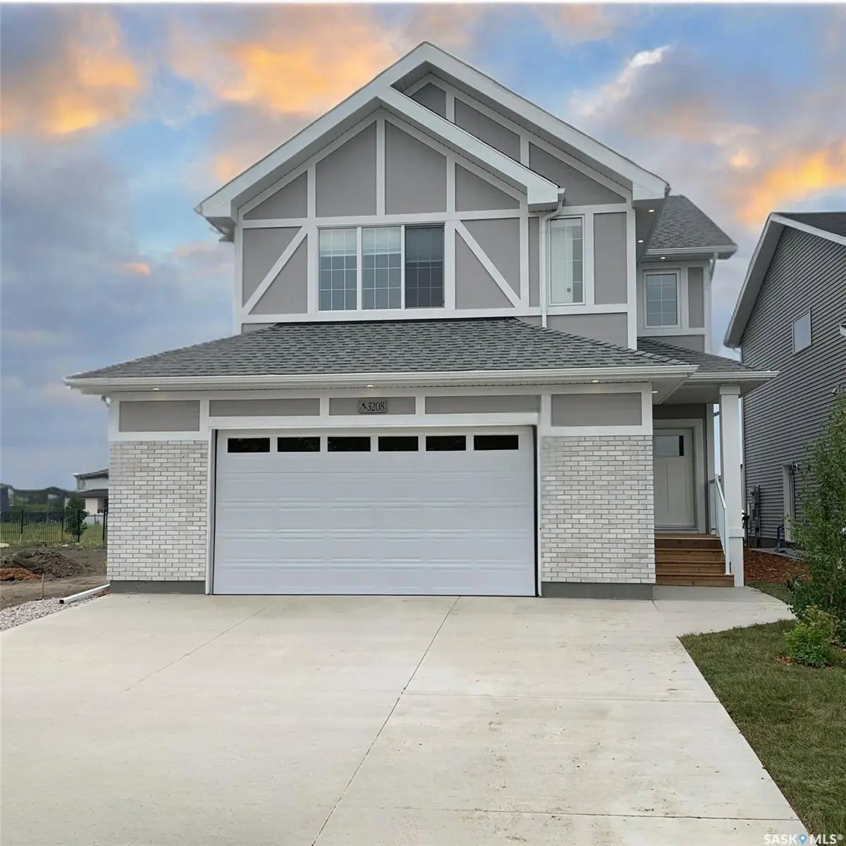 Exterior photo of 951 Traeger Manor, Saskatoon, SK showcasing the front of this spacious two-storey home in Brighton